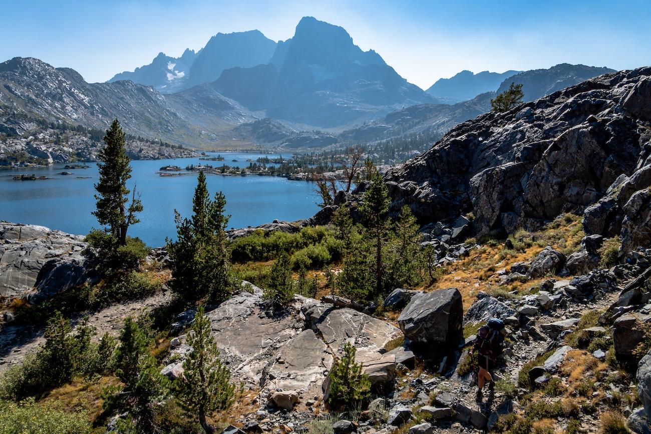 Sam Stych hiking above the shores of Garnet Lake in the Sierras