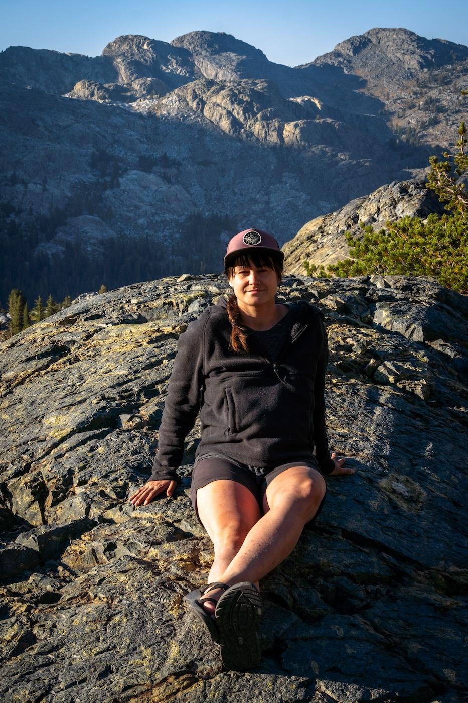 Sam Stych lounging on a rock near Iceberg Lake in the Sierras