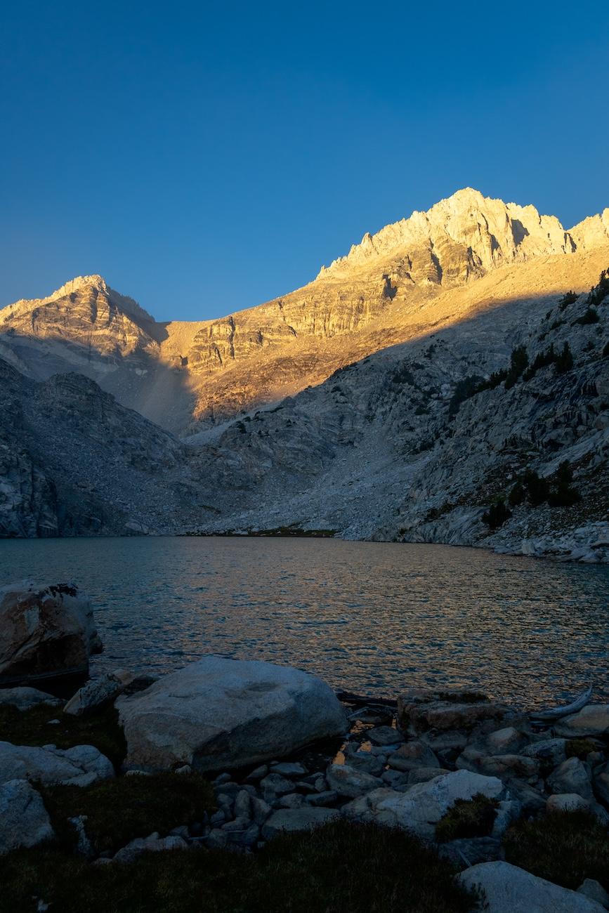 Sunrise on Dade peak above upper Treasure Lake in the Little Lakes Valley in the Sierras.  Photo by Brock Dallman