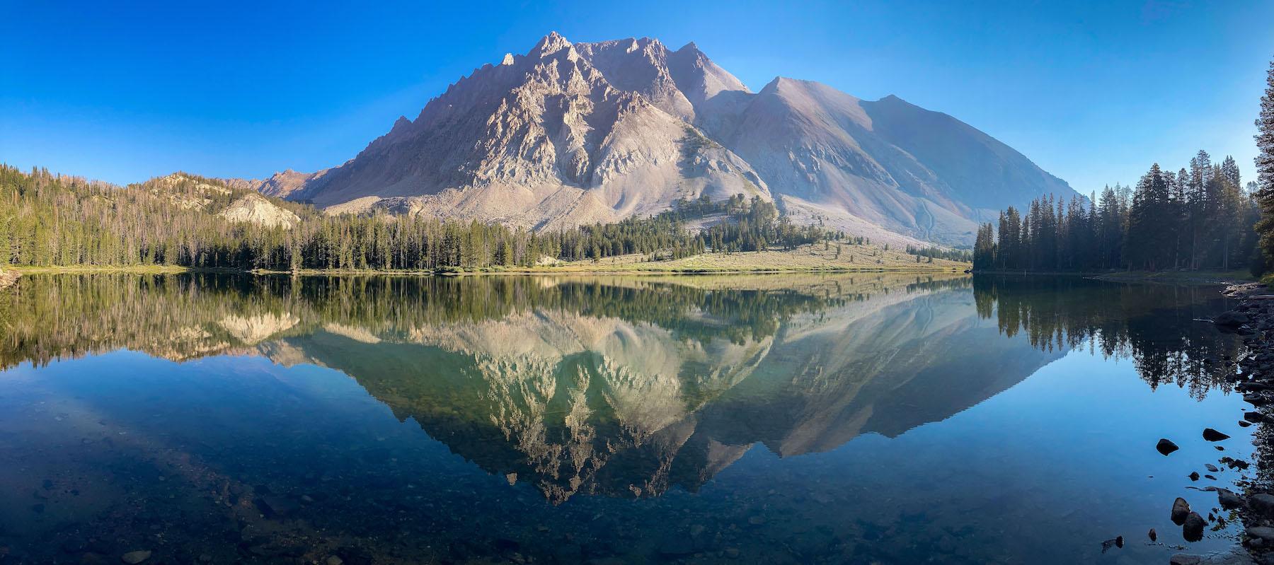 Reflection of Castle Peak in an unamed lake in the Chamberlain Basin