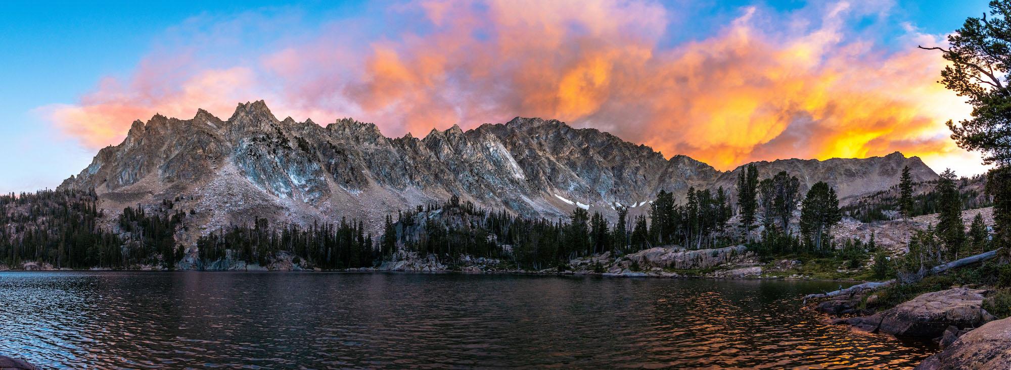 A fiery Sunset behind Castle Peak and Quiet Lake