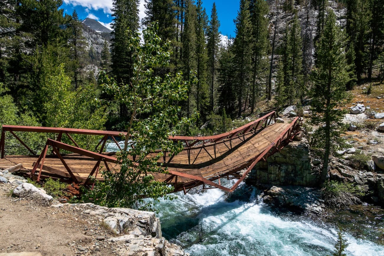 Severely damaged San Joaquin bridge over the raging San Joaquin river in  Kings Canyon National Park.