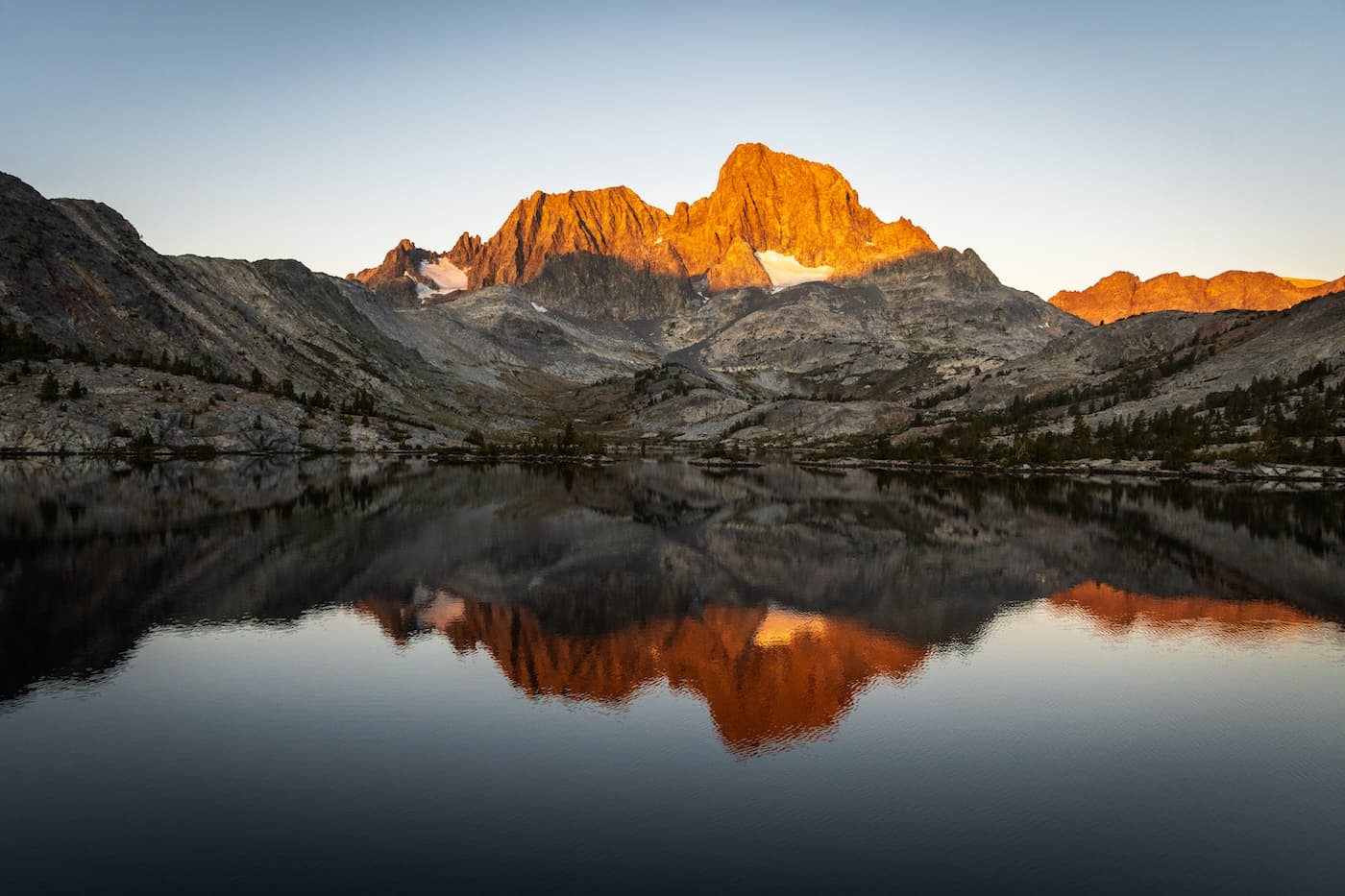Morning sun shining on Banner Peak over Garnet Lake