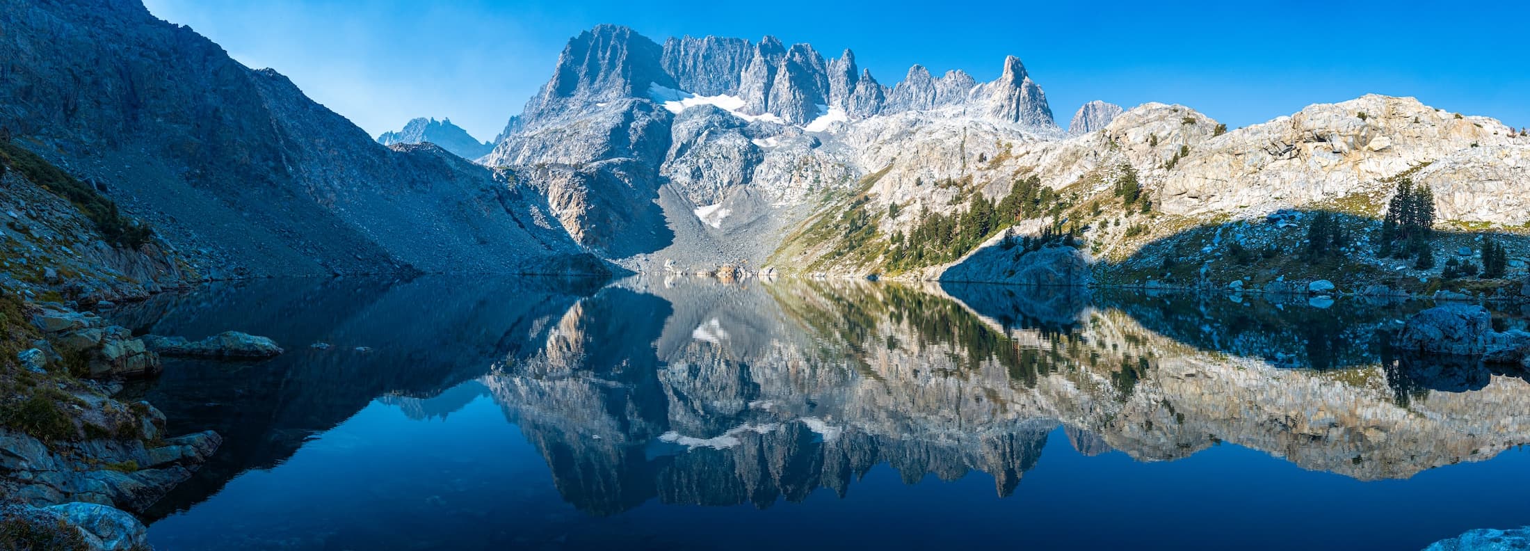 Morning reflection at Iceberg Lake in the Sierras. Photo by Brock Dallman