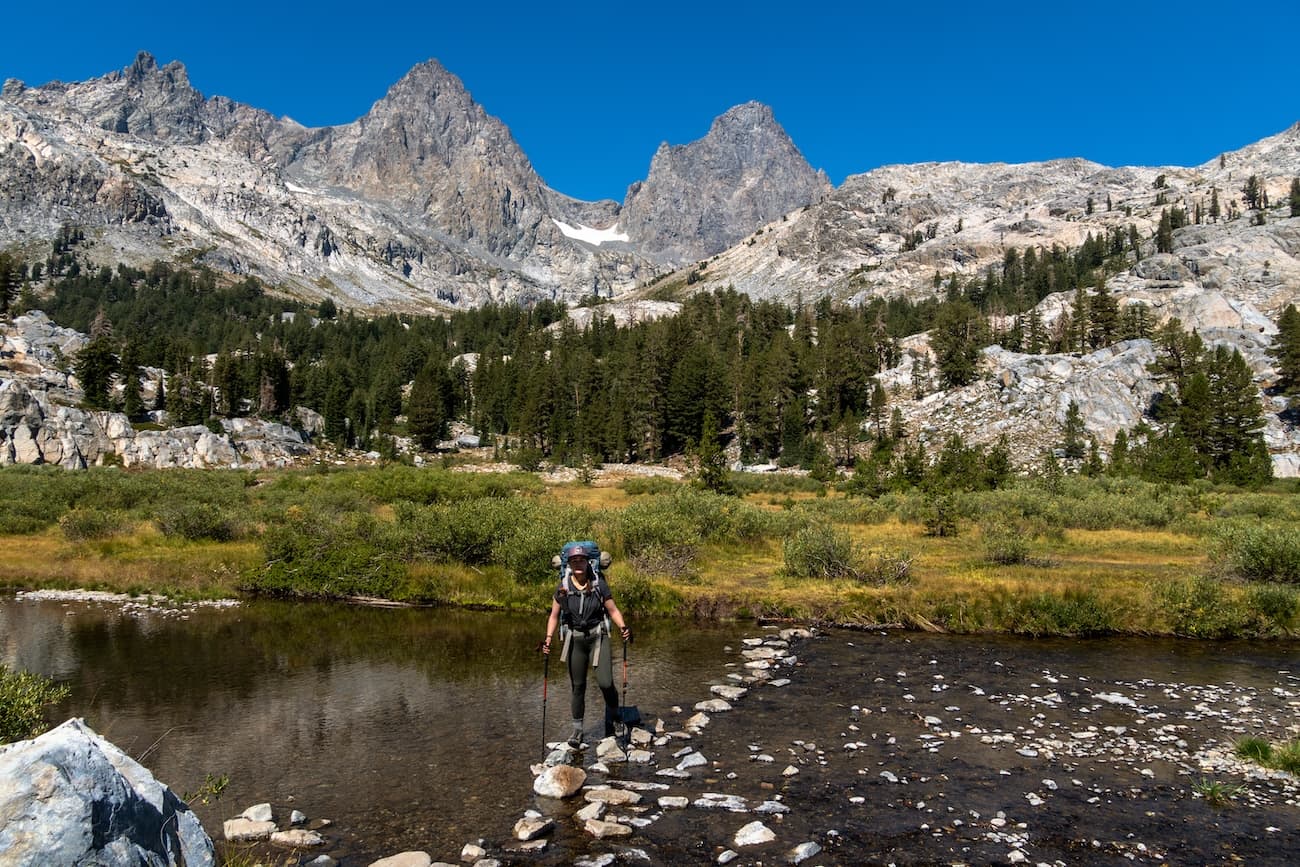Sam crossing a creek near Ediza Lake in the Sierras