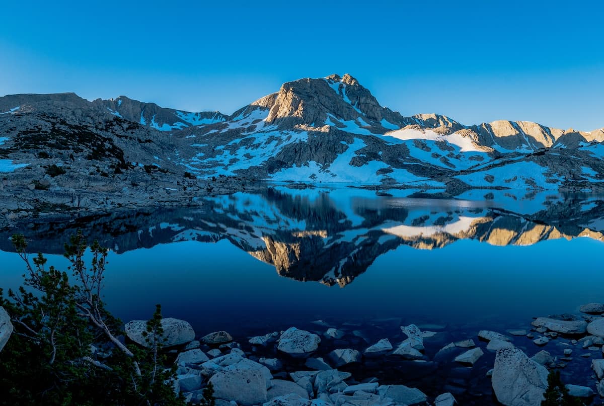 Morning reflection of Muriel Peak over Muriel Lake