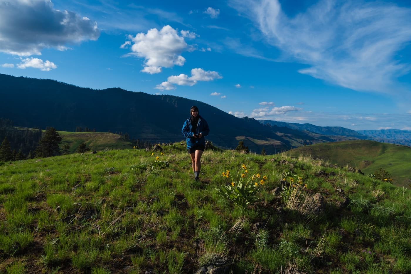Sam Stych in a grassy meadow in Hells Canyon