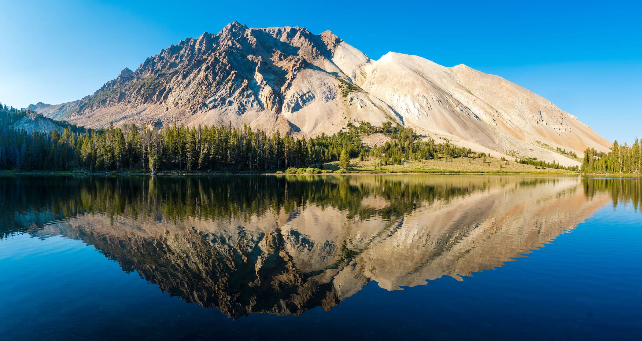 Reflection of Castle Peak in an unamed lake in the Chamberlain Basin