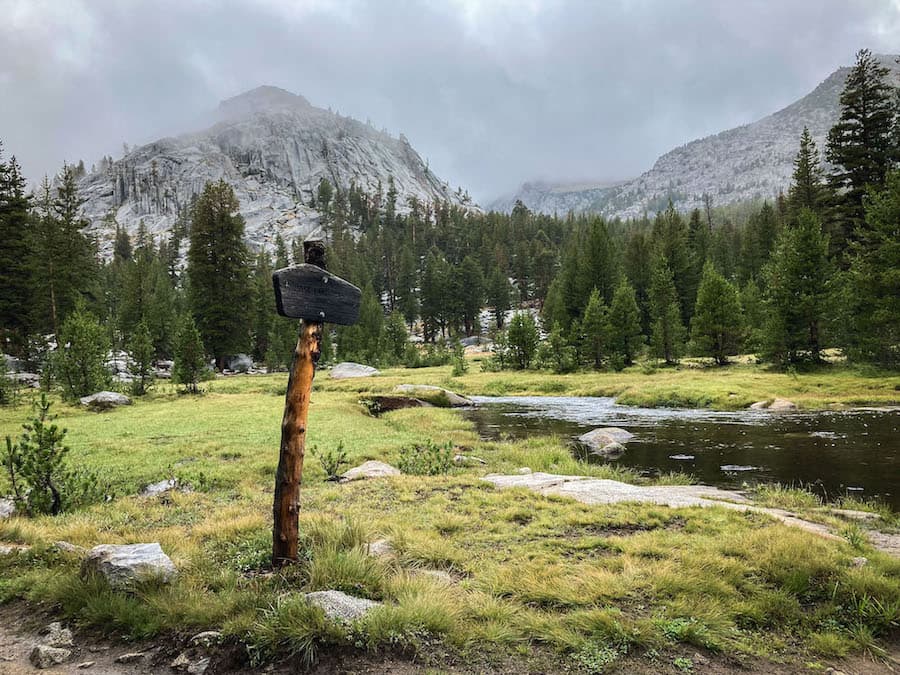 A trail sign in the rainy Sierras