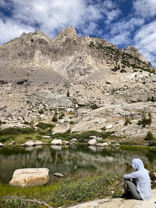 Sam Stych resting at a lake in the Sixty Lake Basin in Kings Canyon National Park