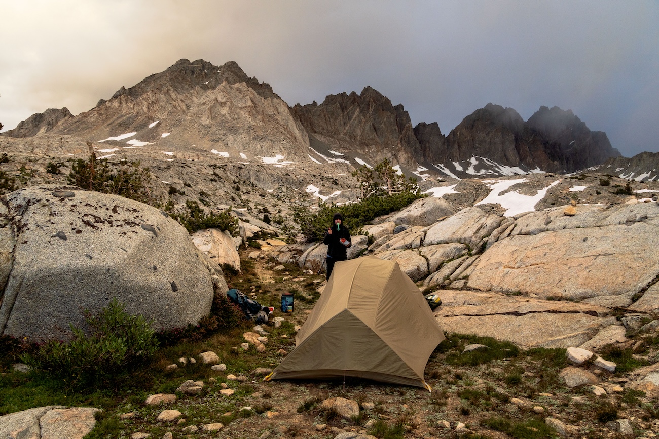 Sam Stych and our Big Agnes tent at a lake in the Dusy Basin of Kings Canyon National Park in the Sierras