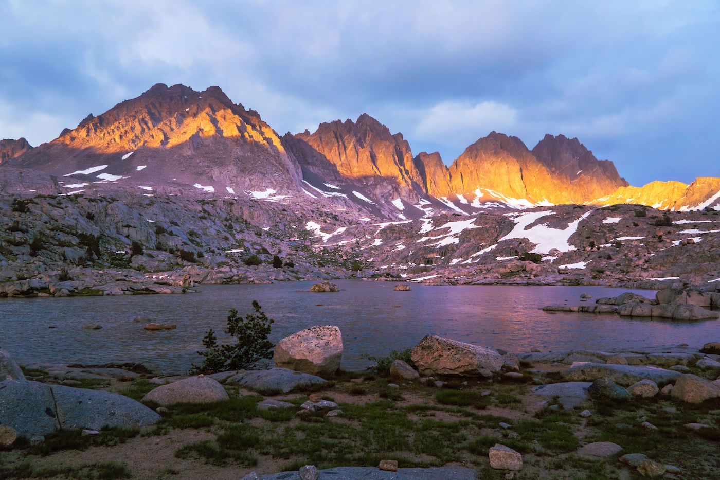 Sun setting at an alpine lake in the Dusy Basin of Kings Canyon National Park in the Sierras